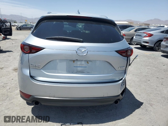 2018 Mazda CX-5 Grand Touring with VIN JM3KFBDM0J0377243, listed as a Copart auction lot 62199295 with 37,930 mi miles and Salvage title. Bid and sale history available at DreamBid. Image 6.
