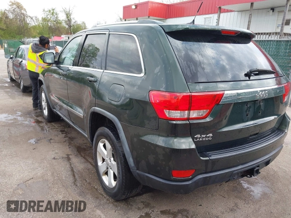 2011 Jeep Grand Cherokee 70th Anniversary with VIN 1J4RR4GG3BC631831, listed as a IAAI auction lot 42038415 with 130,811 mi miles. Bid and sale history available at carsss.com. Image 3.