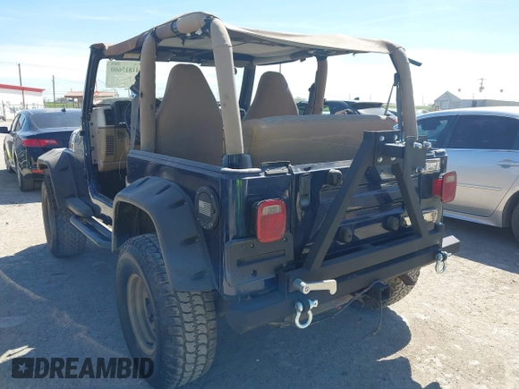 2000 Jeep Wrangler Sport with VIN 1J4FA49S0YP770943, listed as a IAAI auction lot 41817600 with 165,379 mi miles and . Bid and sale history available at DreamBid. Image 3.