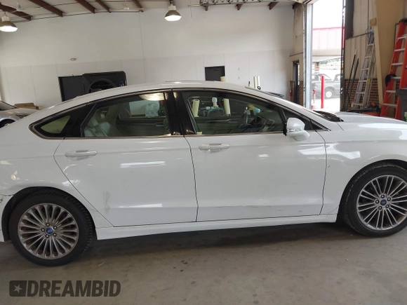 2014 Ford Fusion SE with VIN 3FA6P0HD8ER372731, listed as a IAAI auction lot 39915643 with 136,635 mi miles and . Bid and sale history available at DreamBid. Image 13.