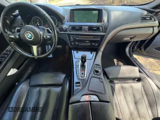 2014 BMW 6 Series z VIN WBAYP9C52ED16921, wystawiony jako Copart lot #55470855 z przebiegiem 101 777 mil mil oraz Czysty tytuł • Clean title. Historia ofert i sprzedaży dostępna na DreamBid. Obrazek 9.