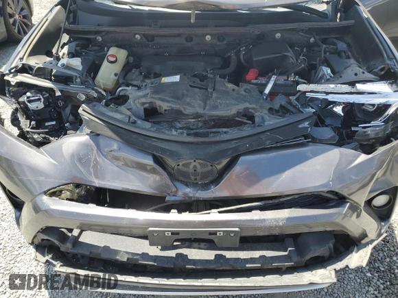 2016 Toyota RAV4 SE with VIN JTMNFREV2GJ072643, listed as a Copart auction lot 63879695 with 104,118 mi miles and Salvage title. Bid and sale history available at DreamBid. Image 12.