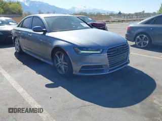 2016 Audi A6 Premium Plus z VIN WAUFGAFC3GN010108, wystawiony jako IAAI lot #42009108 z przebiegiem 101 190 mil mil oraz . Historia ofert i sprzedaży dostępna na DreamBid. Obrazek 1.