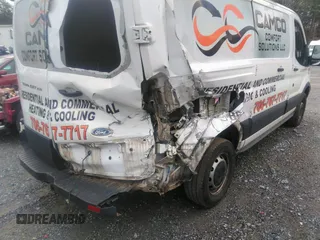 2016 Ford Transit Cargo with VIN 1FTYR1ZM7GKA14464, listed as a IAAI auction lot 41230405 with 120,604 mi miles and . Bid and sale history available at DreamBid. Image 6.