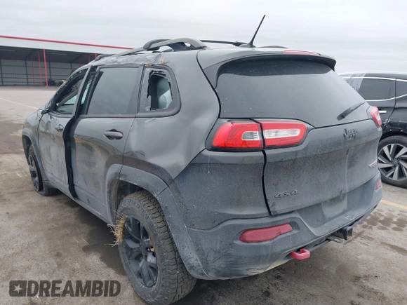 2015 Jeep Cherokee Trailhawk with VIN 1C4PJMBS0FW668730, listed as a IAAI auction lot 41462037 with 83,454 mi miles. Bid and sale history available at carsss.com. Image 3.