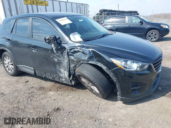 2016 Mazda CX-5 Sport with VIN JM3KE4BY3G0843177, listed as a IAAI auction lot 41804094 with 193,461 mi miles. Bid and sale history available at carsss.com. Image 1.