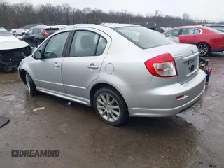 2011 Suzuki SX4 with VIN JS2YC5A41B6300385, listed as a IAAI auction lot 41570810 with 117,847 mi miles and . Bid and sale history available at DreamBid. Image 3.