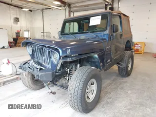 2003 Jeep Wrangler Sport with VIN 1J4FA49S53P311822, listed as a IAAI auction lot 41621710 with 156,023 mi miles. Bid and sale history available at carsss.com. Image 17.