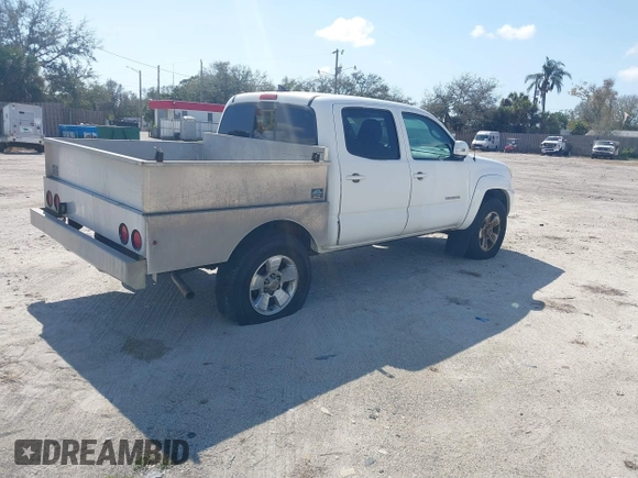 2014 Toyota Tacoma PreRunner with VIN 3TMJU4GN2EM169071, listed as a IAAI auction lot 41543601 with 304,594 mi miles. Bid and sale history available at carsss.com. Image 4.