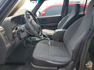 1999 Jeep Cherokee Sport with VIN 1J4FF68S8XL671341, listed as a Copart auction lot 58136475 with 139,848 mi miles and Salvage title. Bid and sale history available at DreamBid. Image 7.