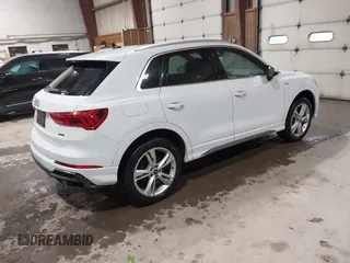 2021 Audi Q3 S line Premium Plus with VIN WA1EECF31M1060356, listed as a IAAI auction lot 42242850 with 83,380 mi miles and . Bid and sale history available at DreamBid. Image 4.