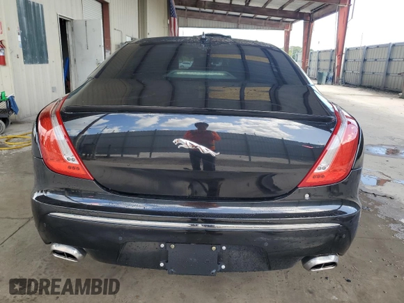 2014 Jaguar XJ Portfolio z VIN SAJWA2GZ4E8V60864, wystawiony jako Copart lot #76478674 z przebiegiem 50 578 mil mil oraz Szkoda całkowita • Salvage title. Historia ofert i sprzedaży dostępna na DreamBid. Obrazek 6.