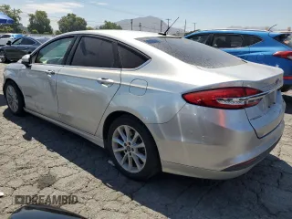2017 Ford Fusion Hybrid SE z VIN 3FA6P0LU9HR306927, wystawiony jako Copart lot #63943395 z przebiegiem 157 851 mil mil oraz Czysty tytuł • Clean title. Historia ofert i sprzedaży dostępna na DreamBid. Obrazek 2.