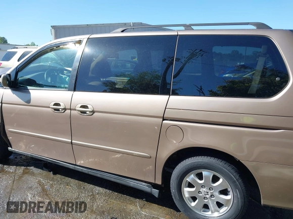 2003 Honda Odyssey EX-L z VIN 5FNRL180X3B055800, wystawiony jako IAAI lot #42053575 z przebiegiem 203 398 mil mil oraz . Historia ofert i sprzedaży dostępna na DreamBid. Obrazek 14.
