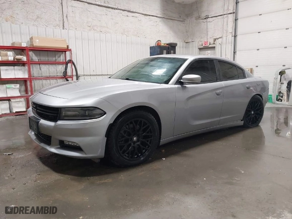2016 Dodge Charger SXT with VIN 2C3CDXJG9GH180966, listed as a IAAI auction lot 41243491 with 127,235 mi miles. Bid and sale history available at carsss.com. Image 2.