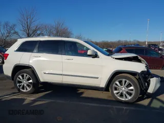 2012 Jeep Grand Cherokee Laredo with VIN 1C4RJFAG5CC310893, listed as a IAAI auction lot 41695279 with 136,821 mi miles. Bid and sale history available at carsss.com. Image 13.