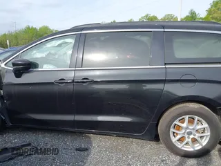 2021 Chrysler Voyager LXI with VIN 2C4RC1DG0MR506659, listed as a IAAI auction lot 42130000 with 121,350 mi miles. Bid and sale history available at carsss.com. Image 14.
