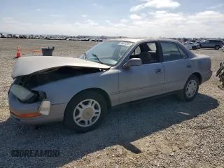 1994 Toyota Camry LE z VIN JT2GK12E6R0055565, wystawiony jako Copart lot #54031255 z przebiegiem 240 841 mil mil oraz Szkoda całkowita • Salvage title. Historia ofert i sprzedaży dostępna na DreamBid. Obrazek 1.