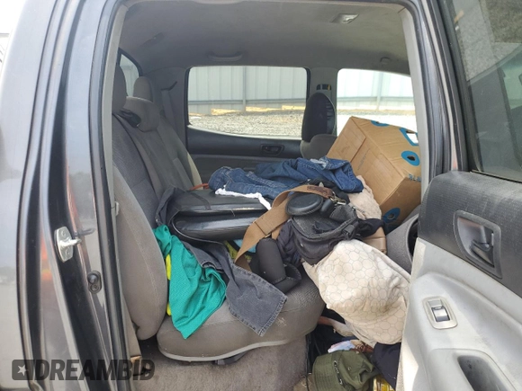 2010 Toyota Tacoma PreRunner with VIN 5TEJU4GN7AZ711911, listed as a Copart auction lot 60200385 with 209,579 mi miles and Salvage title. Bid and sale history available at DreamBid. Image 10.