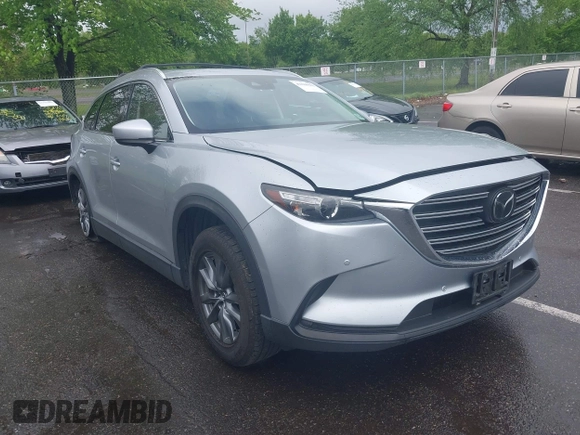 2020 Mazda CX-9 Touring with VIN JM3TCBCY8L0400787, listed as a IAAI auction lot 42188981 with 86,459 mi miles and . Bid and sale history available at DreamBid. Image 1.