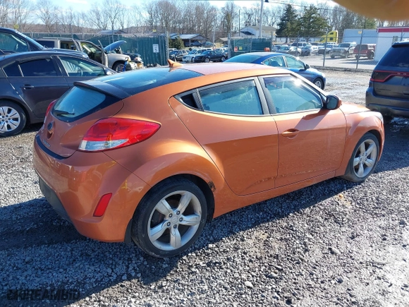 2015 Hyundai Veloster with VIN KMHTC6AD2FU225073, listed as a IAAI auction lot 41571336 with 128,819 mi miles. Bid and sale history available at carsss.com. Image 4.