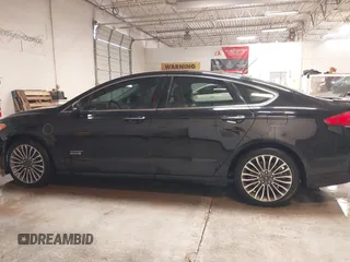 2017 Ford Fusion Titanium with VIN 3FA6P0SUXHR208653, listed as a IAAI auction lot 41312067 with 62,601 mi miles and . Bid and sale history available at DreamBid. Image 14.