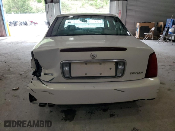 2004 Cadillac DeVille z VIN 1G6KD54Y84U137828, wystawiony jako Copart lot #53702265 z przebiegiem 156 439 mil mil oraz Szkody całkowita. Historia ofert i sprzedaży dostępna na DreamBid. Obrazek 6.