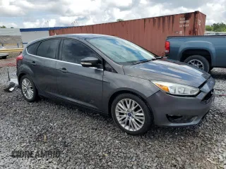 2015 Ford Focus Titanium z VIN 1FADP3N28FL239706, wystawiony jako Copart lot #62478895 z przebiegiem 143 536 mil mil oraz Szkoda całkowita • Salvage title. Historia ofert i sprzedaży dostępna na DreamBid. Obrazek 4.