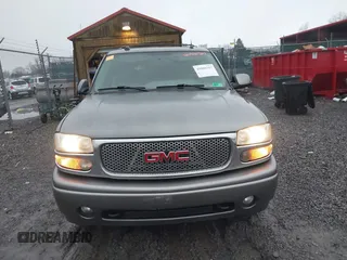 2005 GMC Yukon Denali z VIN 1GKEK63U25J228296, wystawiony jako IAAI lot #40980307 z przebiegiem 192 353 mil mil oraz . Historia ofert i sprzedaży dostępna na DreamBid. Obrazek 12.