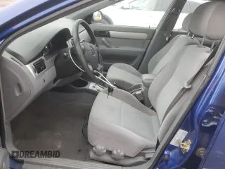 2006 Suzuki Forenza z VIN KL5JD56ZX6K372427, wystawiony jako Copart lot #80627544 z przebiegiem 94 493 mil mil oraz Tytuł czysty. Historia ofert i sprzedaży dostępna na DreamBid. Obrazek 7.