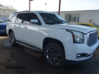 2019 GMC Yukon SLT with VIN 1GKS2BKC5KR109529, listed as a IAAI auction lot 41559860 with 136,025 mi miles. Bid and sale history available at carsss.com. Image 1.