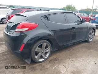 2013 Hyundai Veloster w/Black Int with VIN KMHTC6AD7DU170049, listed as a IAAI auction lot 42441737 with 101,924 mi miles and . Bid and sale history available at DreamBid. Image 4.