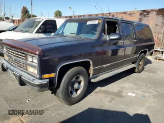 1991 Chevrolet Suburban z VIN 1GNGR26N2MF124400, wystawiony jako Copart lot #85809994 z przebiegiem 160 922 mil mil oraz Czysty tytuł • Clean title. Historia ofert i sprzedaży dostępna na DreamBid. Obrazek 1.