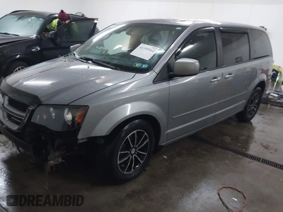 2015 Dodge Grand Caravan SE with VIN 2C4RDGBG9FR703691, listed as a IAAI auction lot 41395564 with 170,735 mi miles and . Bid and sale history available at DreamBid. Image 2.