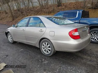 2003 Toyota Camry LE with VIN 4T1BE30K13U705105, listed as a IAAI auction lot 41696395 with 191,389 mi miles and . Bid and sale history available at DreamBid. Image 3.