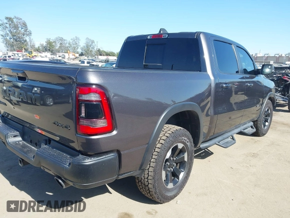 2022 Ram 1500 Rebel z VIN 1C6SRFLT4NN177112, wystawiony jako IAAI lot #42402050 z przebiegiem 26 239 mil mil oraz . Historia ofert i sprzedaży dostępna na DreamBid. Obrazek 4.
