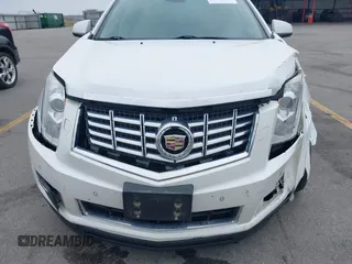 2013 Cadillac SRX Performance Collection z VIN 3GYFNHE35DS569528, wystawiony jako IAAI lot #42329652 z przebiegiem 97 184 mil mil oraz . Historia ofert i sprzedaży dostępna na DreamBid. Obrazek 6.