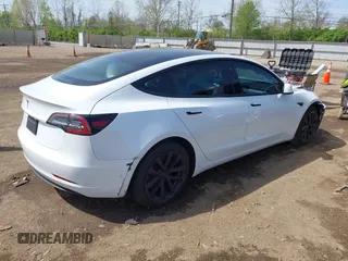 2020 Tesla Model 3 Standard Range Plus with VIN 5YJ3E1EA3LF785951, listed as a IAAI auction lot 41919339 with 63,025 mi miles and . Bid and sale history available at carsss.com. Image 4.