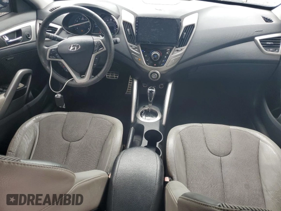 2012 Hyundai Veloster w/Black Int z VIN KMHTC6AD1CU030478, wystawiony jako Copart lot #62715005 z przebiegiem 127 625 mil mil oraz Szkoda całkowita • Salvage title. Historia ofert i sprzedaży dostępna na DreamBid. Obrazek 8.