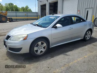 2009 Pontiac G6 1SB with VIN 1G2ZJ57B994273229, listed as a Copart auction lot 56527605 with 198,862 mi miles and Salvage title. Bid and sale history available at DreamBid. Image 1.