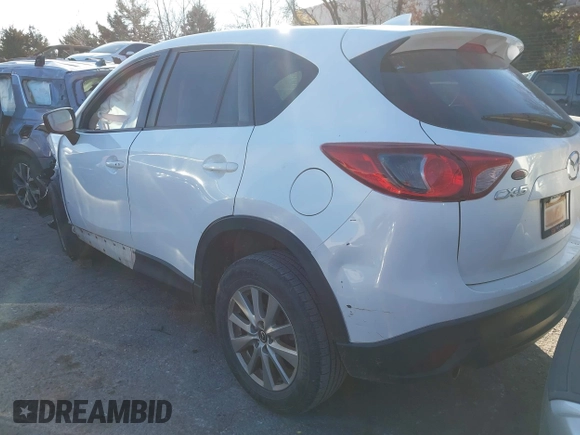 2016 Mazda CX-5 Touring z VIN JM3KE2CY9G0807688, wystawiony jako IAAI lot #41039438 z przebiegiem 169 483 mil mil oraz . Historia ofert i sprzedaży dostępna na DreamBid. Obrazek 3.