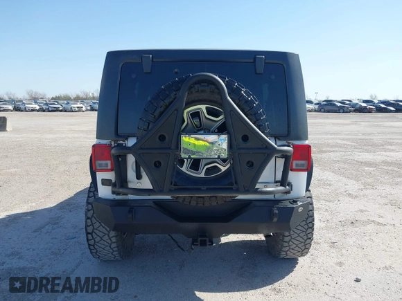2014 Jeep Wrangler Unlimited Rubicon with VIN 1C4BJWFG1EL167423, listed as a IAAI auction lot 41861109 with 104,669 mi miles. Bid and sale history available at carsss.com. Image 16.