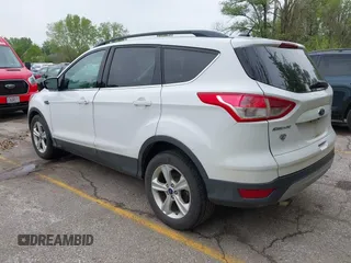 2016 Ford Escape SE with VIN 1FMCU9GX1GUC04085, listed as a IAAI auction lot 42126826 with 130,728 mi miles. Bid and sale history available at carsss.com. Image 3.