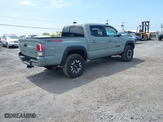 2023 Toyota Tacoma 4WD SR with VIN 3TYCZ5AN7PT145185, listed as a IAAI auction lot 41658297 with 23,647 mi miles. Bid and sale history available at carsss.com. Image 4.