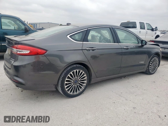 2017 Ford Fusion Hybrid Titanium with VIN 3FA6P0RU7HR388521, listed as a Copart auction lot 57318895 with 117,720 mi miles and Salvage title. Bid and sale history available at DreamBid. Image 3.