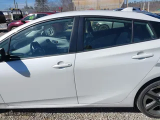 2021 Toyota Prius L Eco with VIN JTDKAMFUXM3142402, listed as a IAAI auction lot 41665484 with 67,416 mi miles. Bid and sale history available at carsss.com. Image 14.