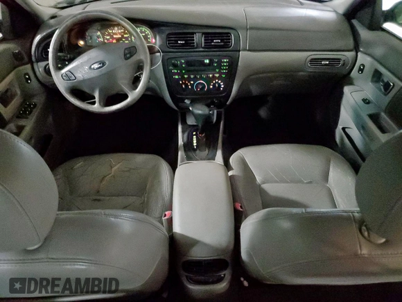 2002 Ford Taurus SES Standard z VIN 1FAFP55U72A161401, wystawiony jako Copart lot #55893125 z przebiegiem 128 258 mil mil oraz Czysty tytuł • Clean title. Historia ofert i sprzedaży dostępna na DreamBid. Obrazek 8.