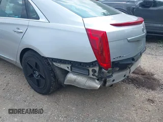 2014 Cadillac XTS Luxury z VIN 2G61N5S38E9270619, wystawiony jako IAAI lot #40140617 z przebiegiem 117 286 mil mil oraz . Historia ofert i sprzedaży dostępna na DreamBid. Obrazek 13.