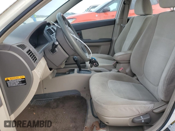 2006 Kia Spectra EX with VIN KNAFE121265208526, listed as a Copart auction lot 80300604 with 101,780 mi miles and Salvage Title. Bid and sale history available at carsss.com. Image 7.