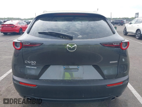 2024 Mazda CX-30 S Carbon Edition with VIN 3MVDMBCM5RM665341, listed as a IAAI auction lot 42180459 with 4,496 mi miles and . Bid and sale history available at DreamBid. Image 16.